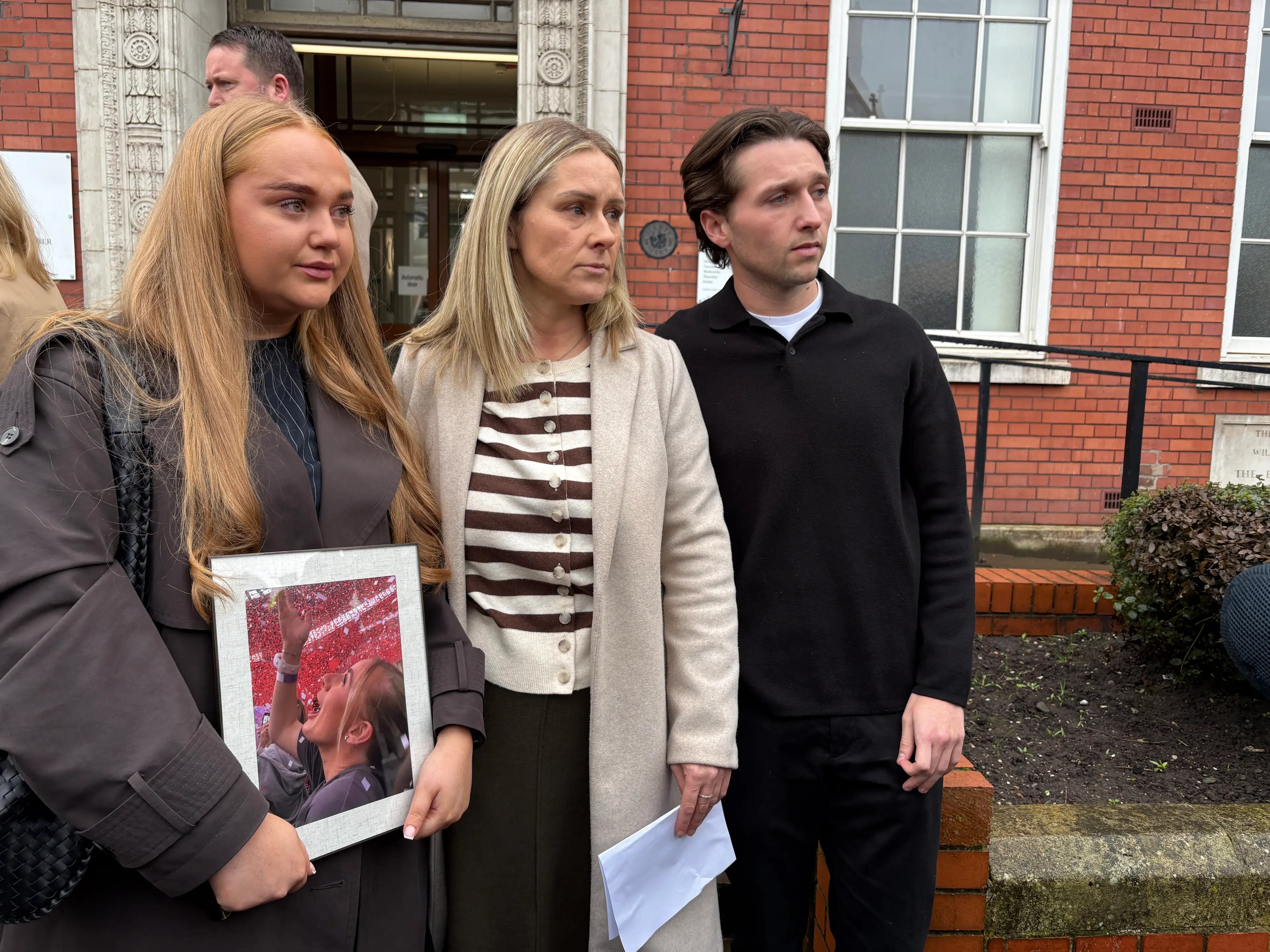 Lucy's friend Ella Gowing, her mother Jane Coates and her boyfriend Sam Littler pictured after the inquest (Eleanor Barlow/PA Wire)