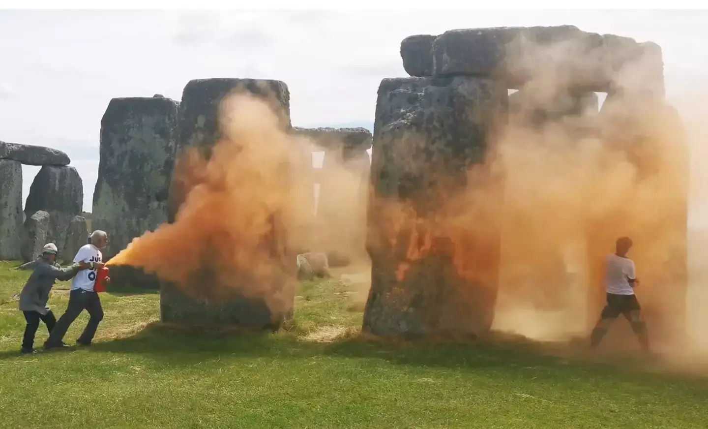 Stonehenge was blasted with orange paint on Wednesday by campaigners (X/@JustStop_Oil)