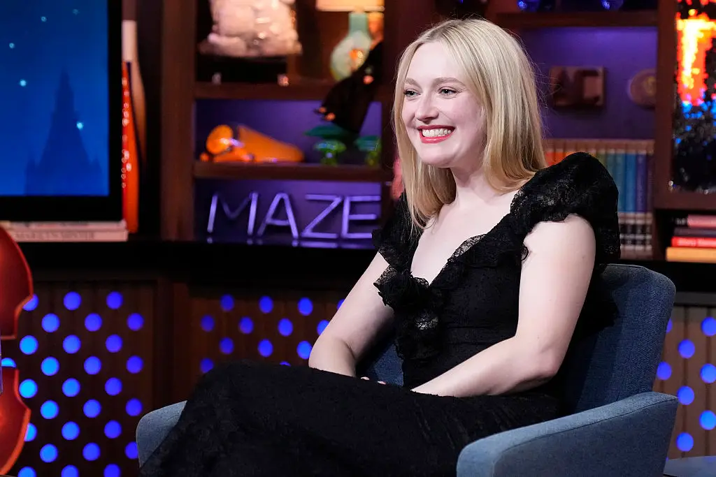 Dakota Fanning is really cashing in on her friendship with Tom Cruise (Charles Sykes/Bravo via Getty Images)