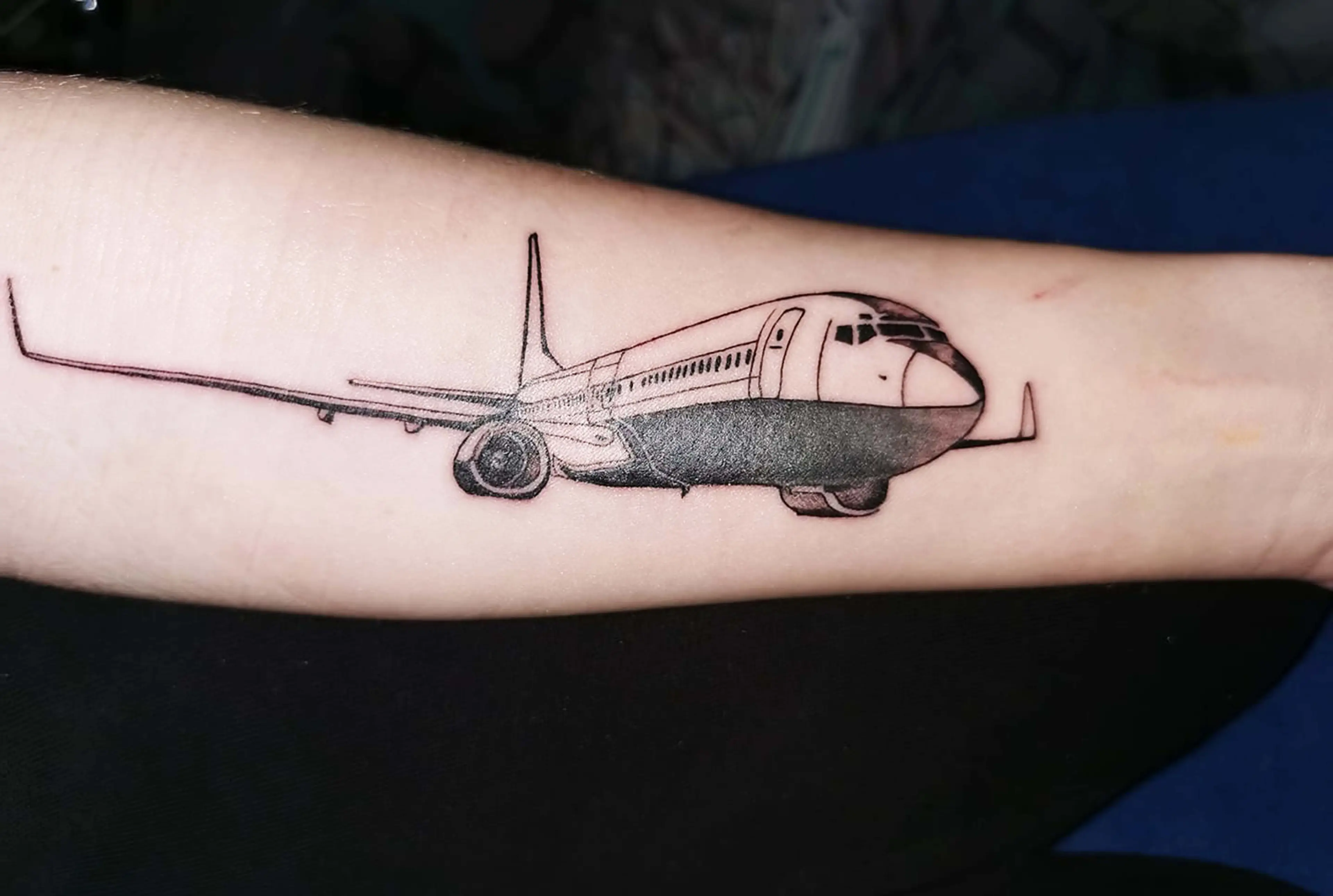 Sarah even has two tattoos of her plane 'boyfriend'.