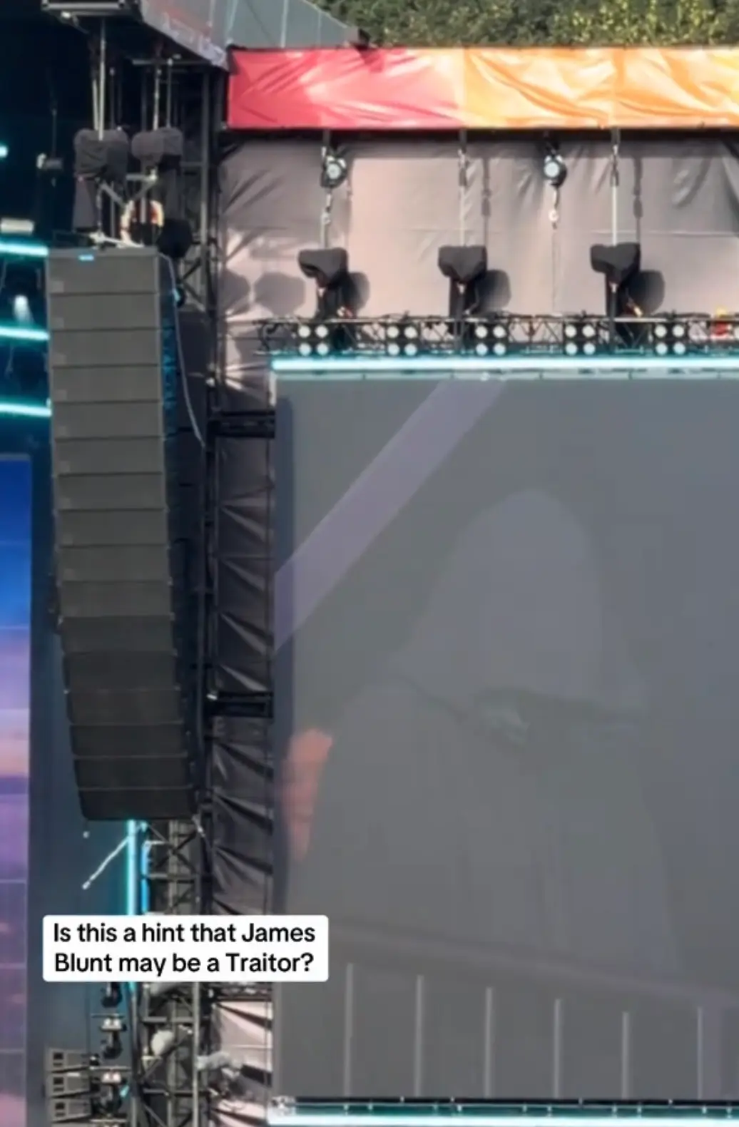 An individual wearing a cloak was spotted lurking near the stage during the singer's performance at Radio 2 in the Park (TikTok/@kieramcfarlanee)