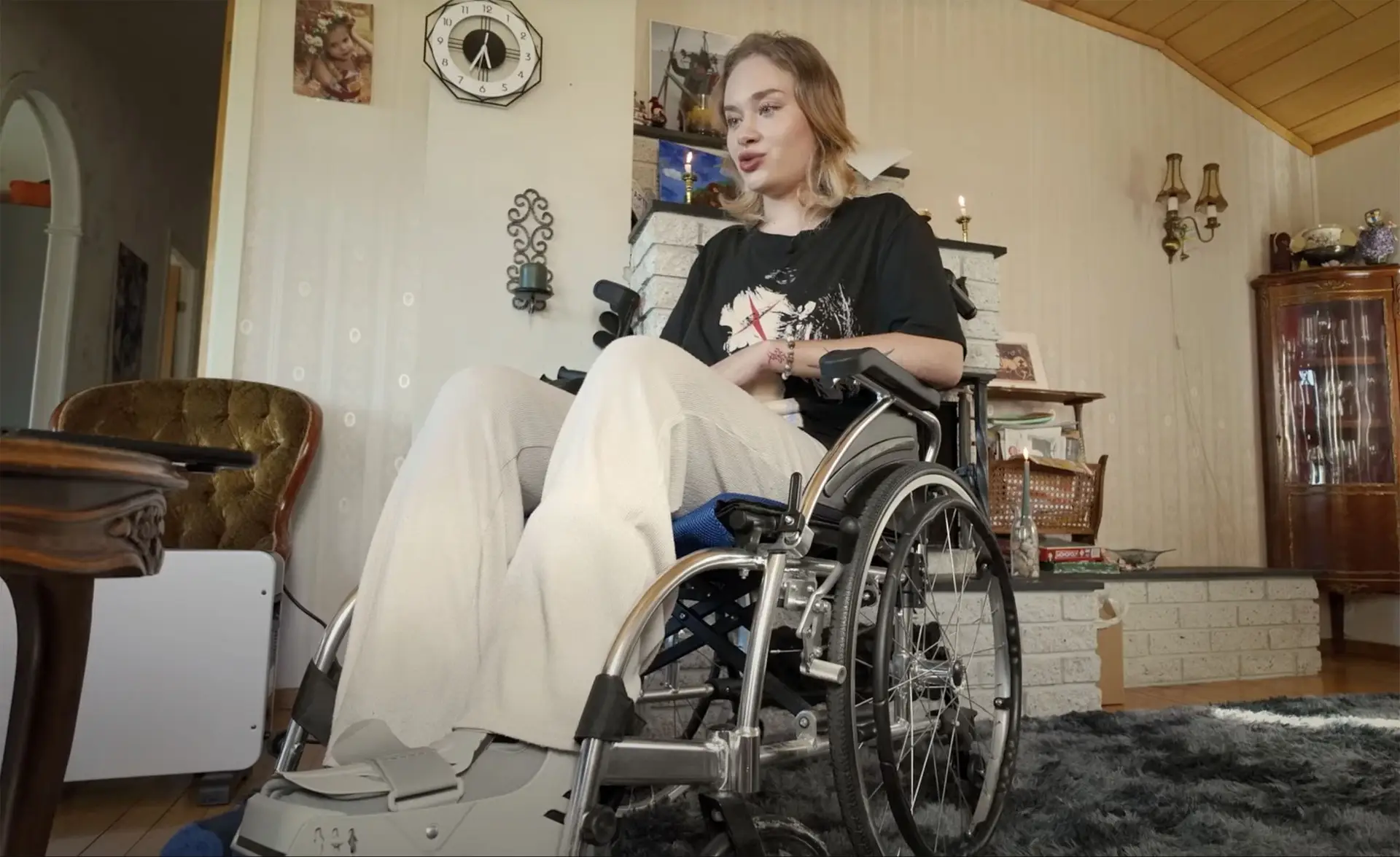 Her injuries included a broken spine and limbs, and she is in a wheelchair as she learns to walk again (East2West)