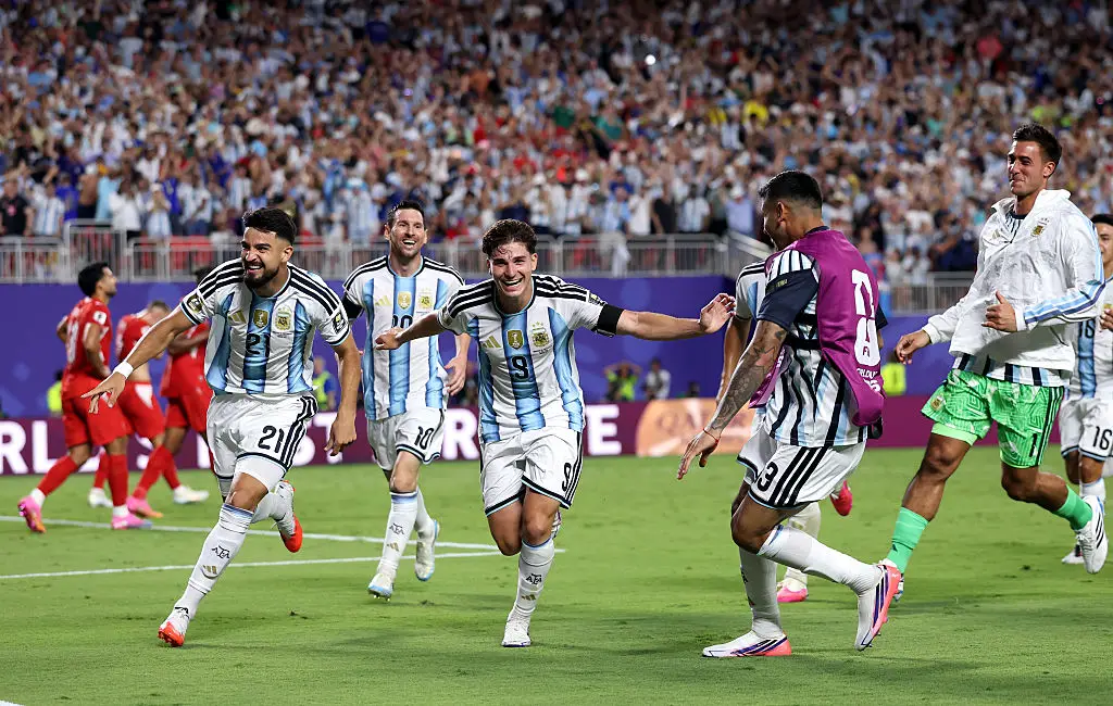Argentina's team were seen wearing black armbands in their match against Switzerland on Sunday (Carl Recine/Getty Images)
