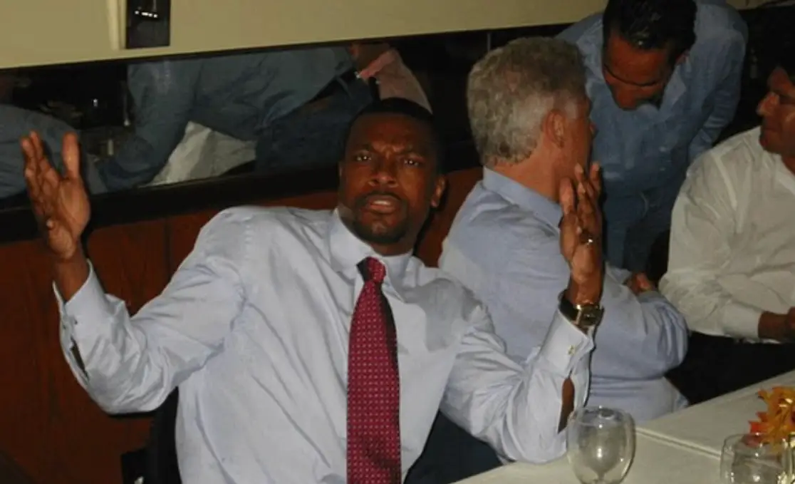 Chris Tucker seen at what looks like a dinner party (Department of Justice)