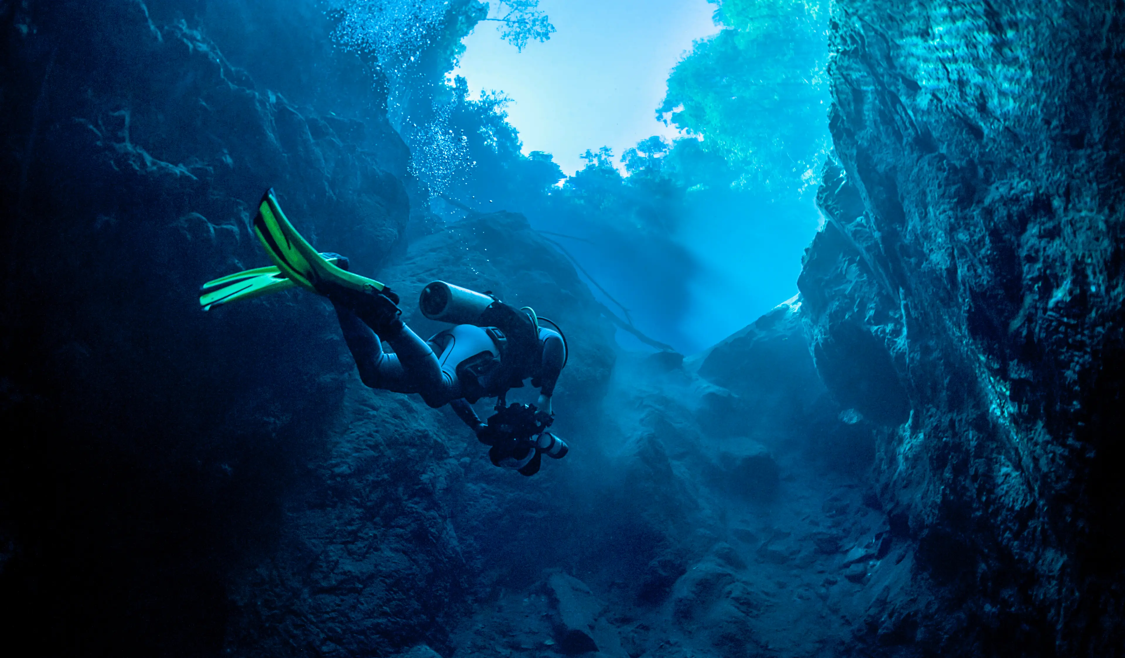 Scuba divers rely on compressed air in their tanks to breathe underwater (Getty Stock Image)