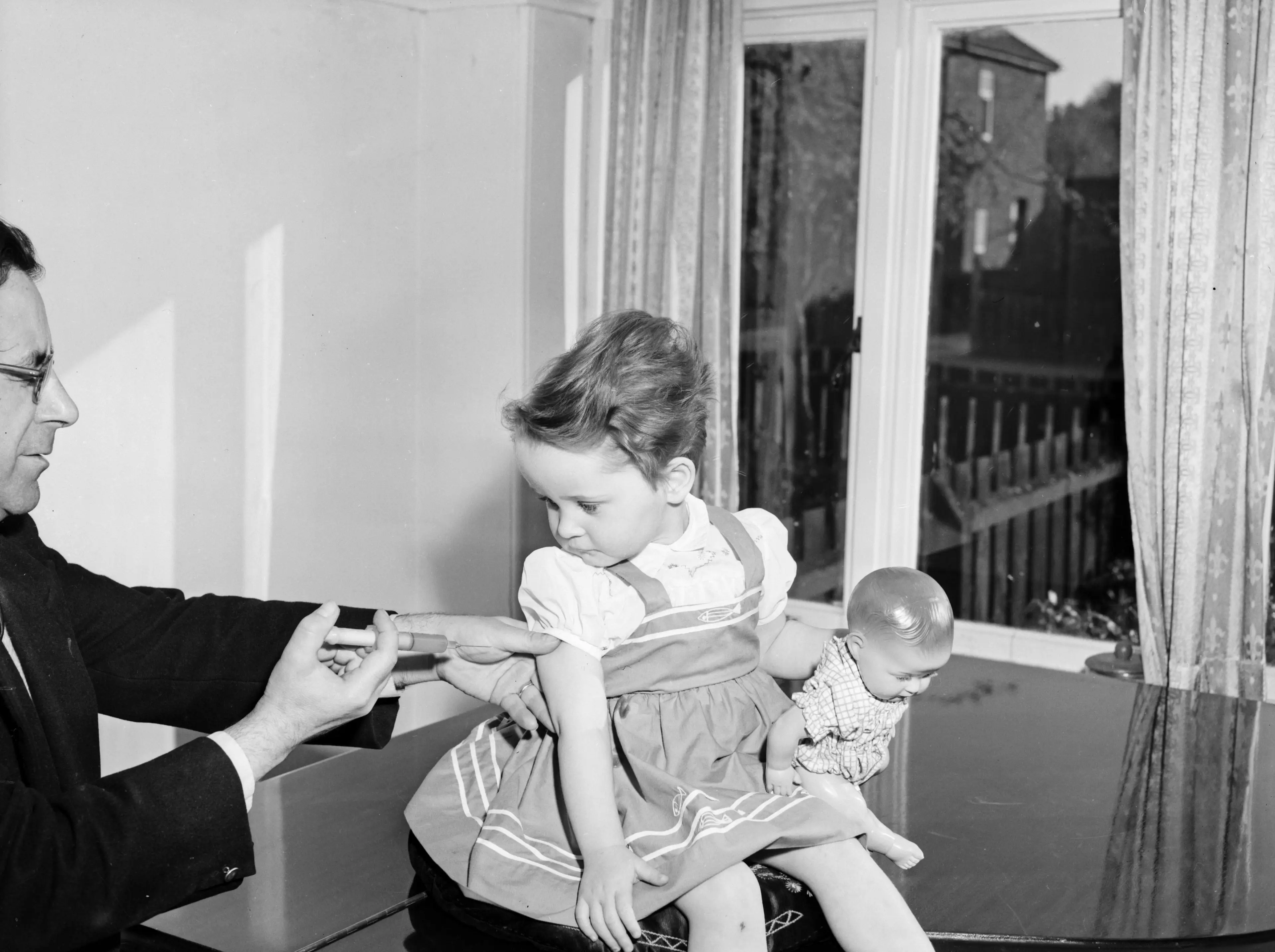 A child receives a polio vaccine in 1959.