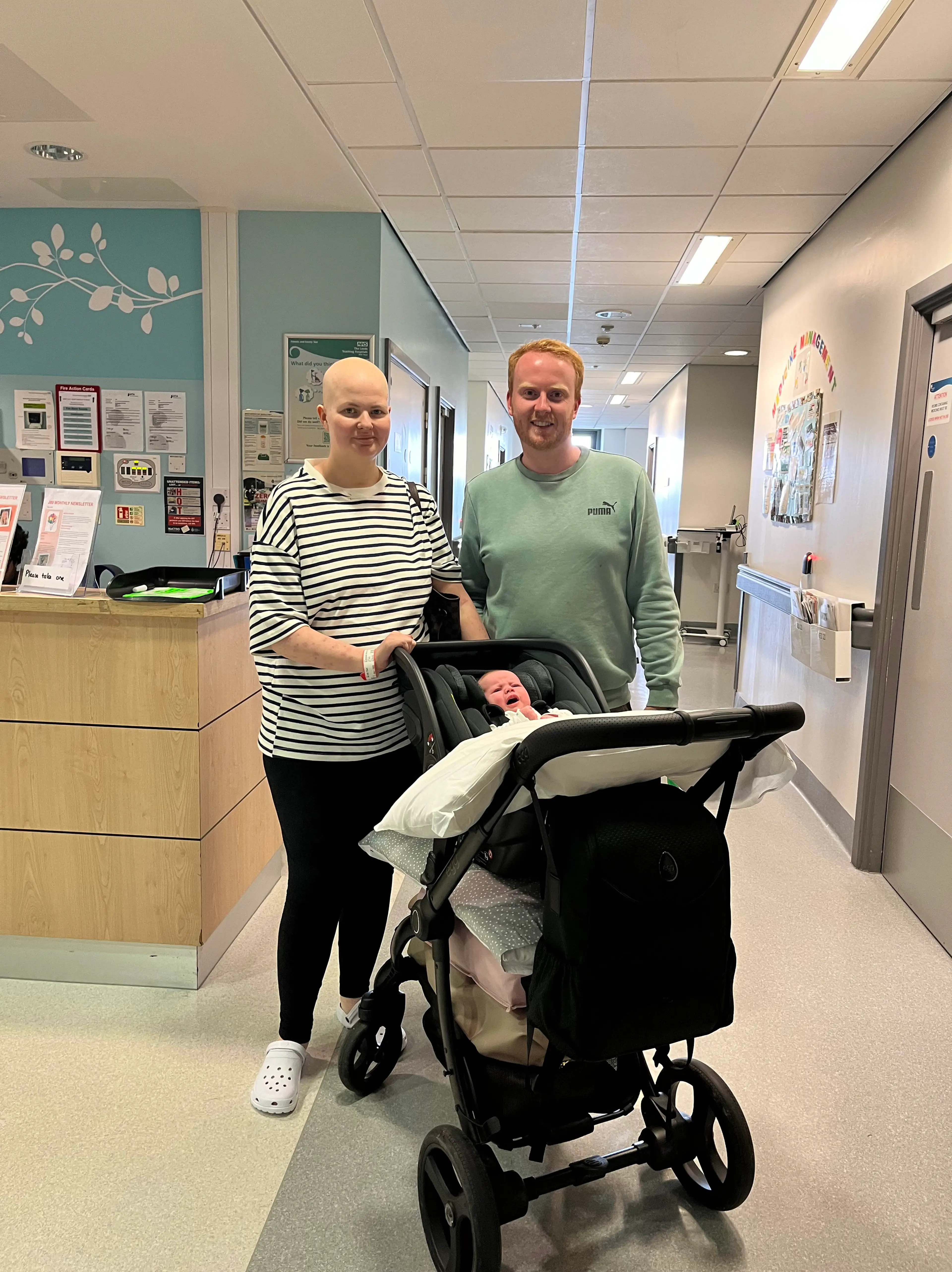 Rebecca with her husband James and daughter Annabel in hospital (PA)
