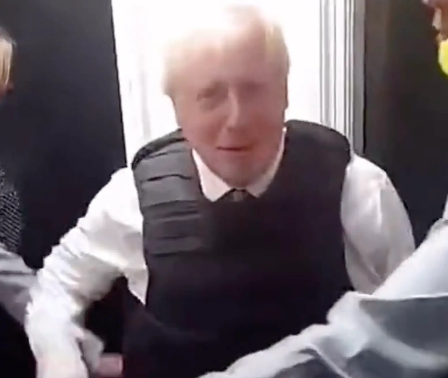 The prime minister appeared to try and wave at the camera at one point.