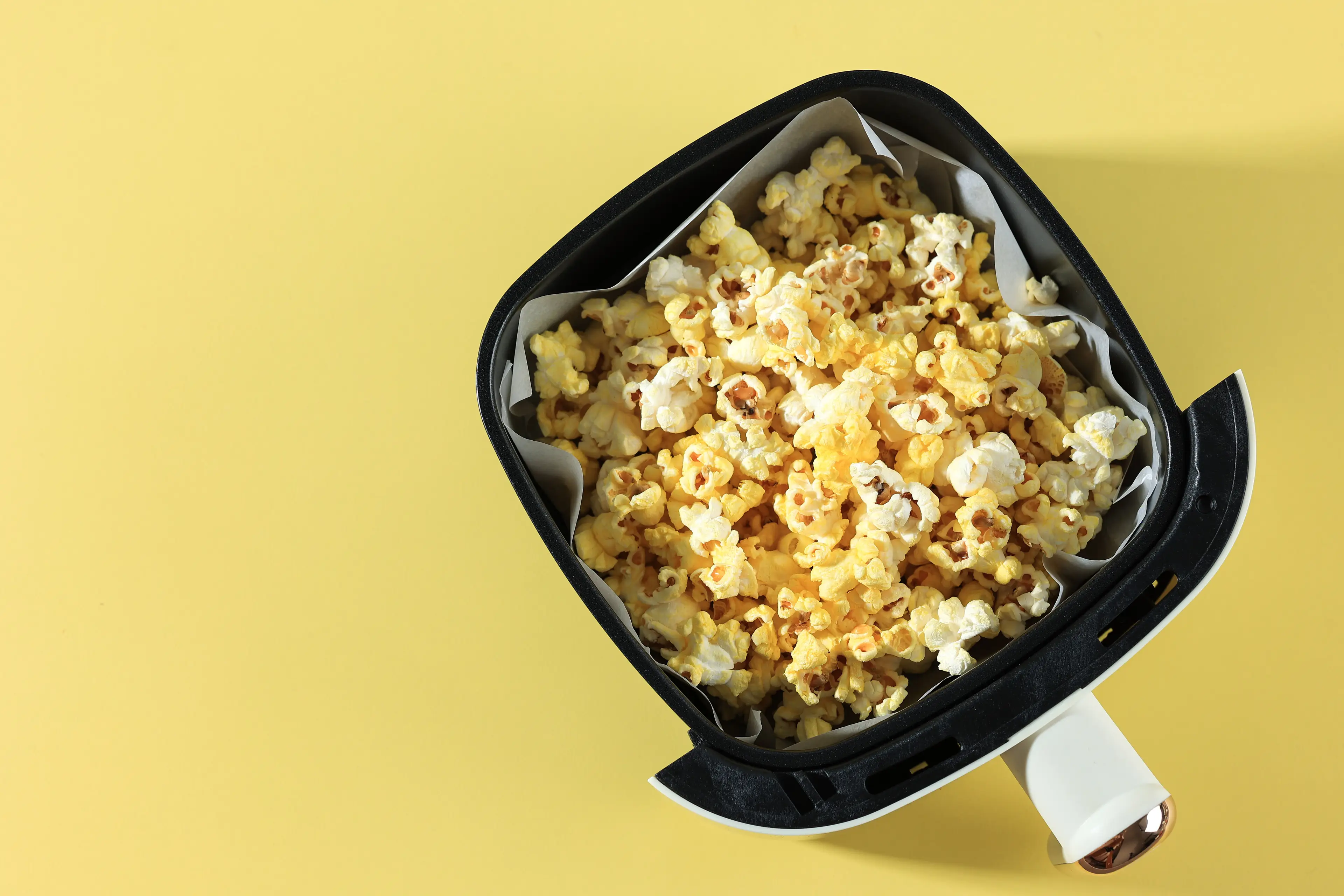 Bits of popcorn can get stuck in your air fryer and mess it up. (Getty Stock Photo)