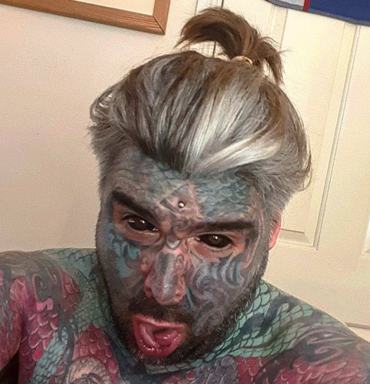 King Of Ink Land opened up about how his tattoos affected his professional life.