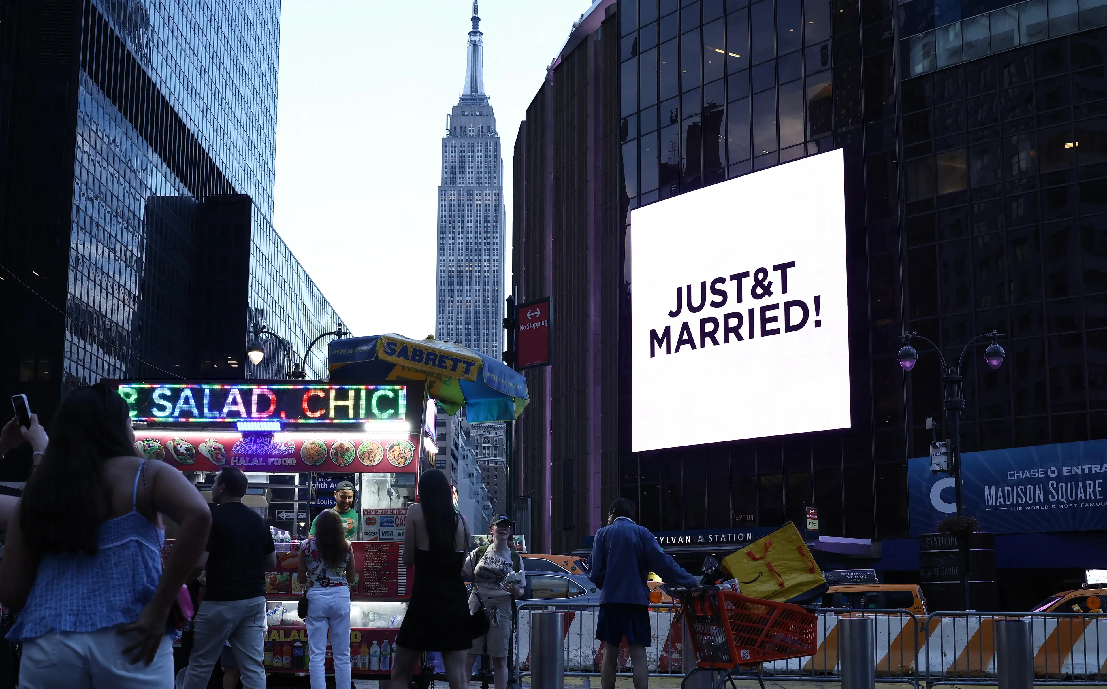 A giant screen sported the message 'JUST&T MARRIED!' after the duo said their vows (CHARLY TRIBALLEAU / AFP via Getty Images)