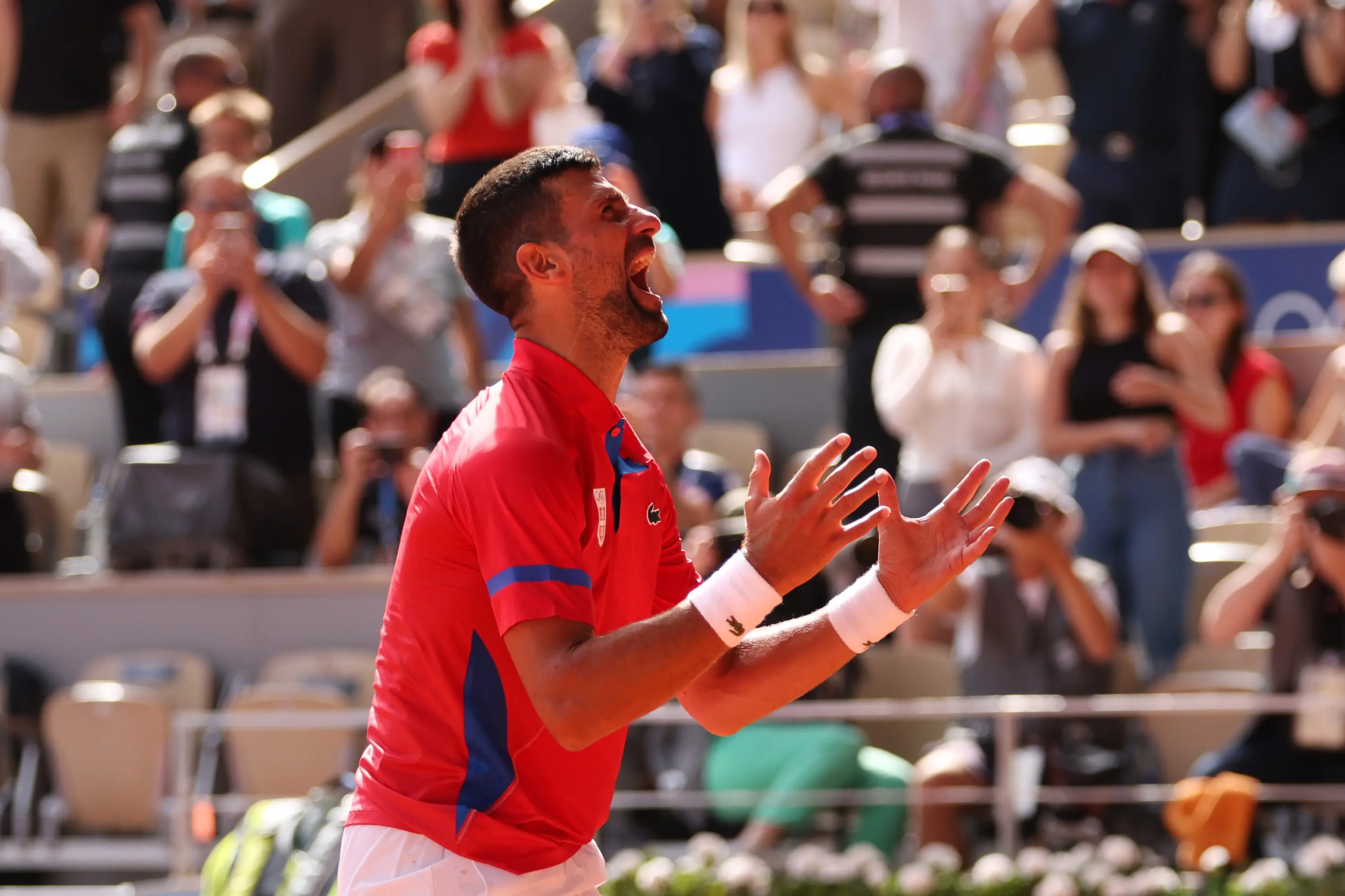 The moment Djokovic won gold in what is likely his last Olympics. (Clive Brunskill/Getty Images)