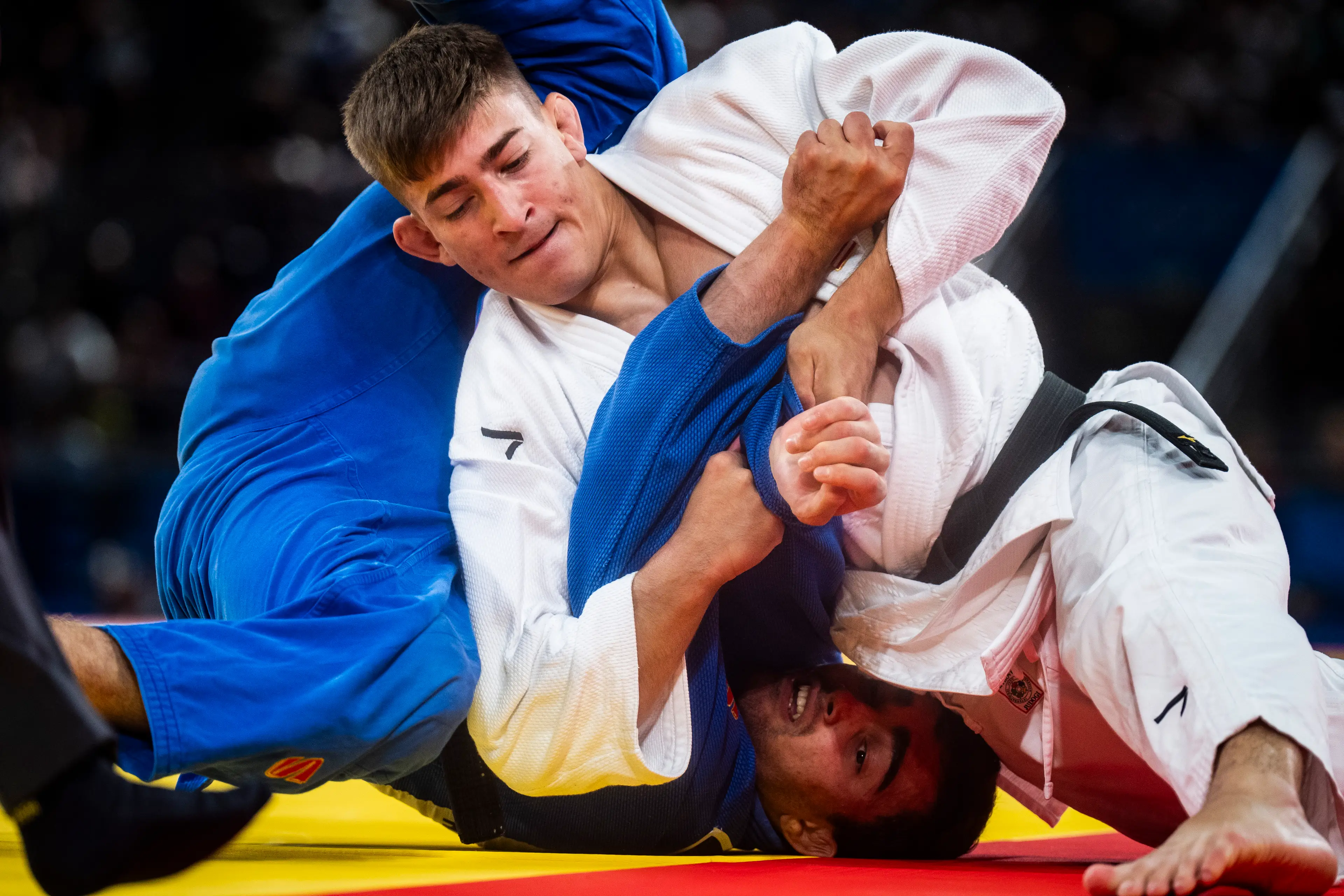 Jack Yonezuka, of the United States, and Adil Osmanov, of Moldova, competing in the judo (Jabin Botsford / The Washington Post via Getty Images)