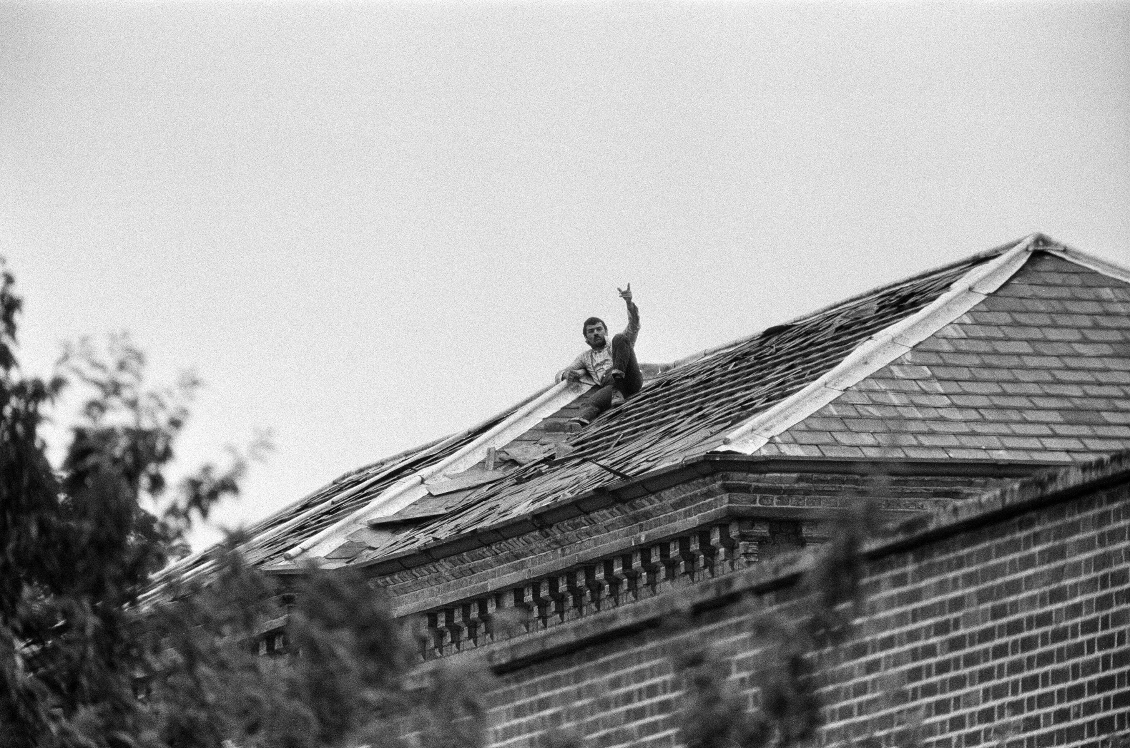 Bronson seen on the roof of Broadmoor Hospital while staging a protest in June 1983 (Hart/Mirrorpix/Getty Images)