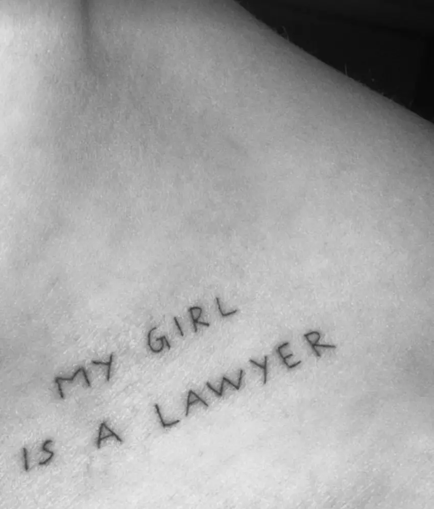 Davidson branded Kardashian's name into his skin and got a sweet inking paying homage to her law studies (Instagram/@kimkardashian)