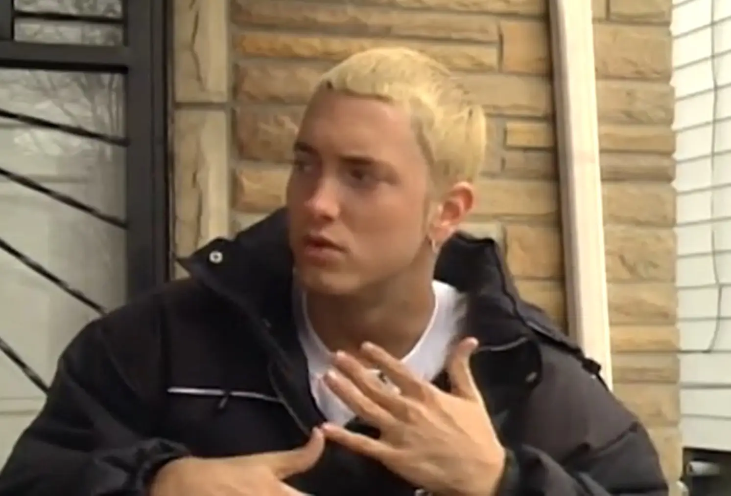 The rapper instead sat on his old doorstep and remembered what it was like living in the house.