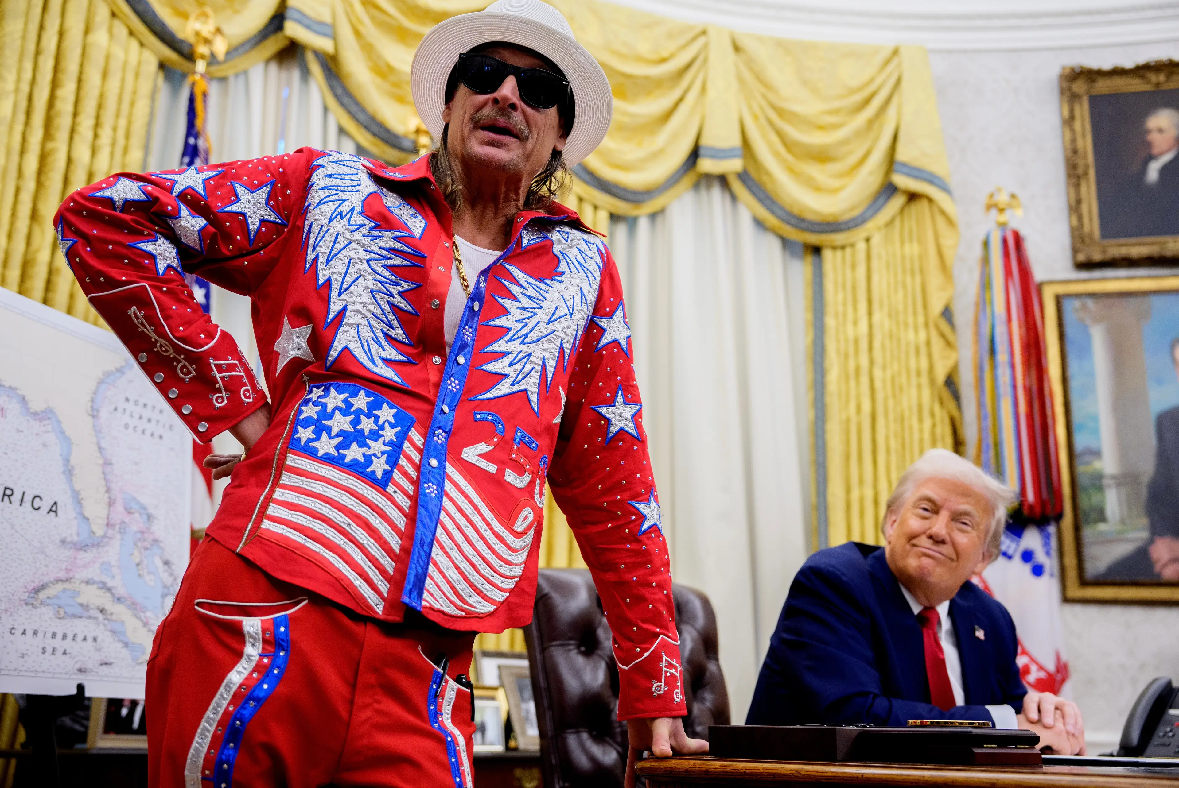 Kid Rock, pictured with Trump in March last year, is among the performers taking to the stage at the 'All-American' gig (Andrew Harnik/Getty Images)