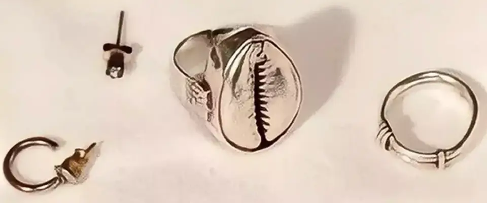 Items of jewellery worn by the woman on the day of her death (PA)