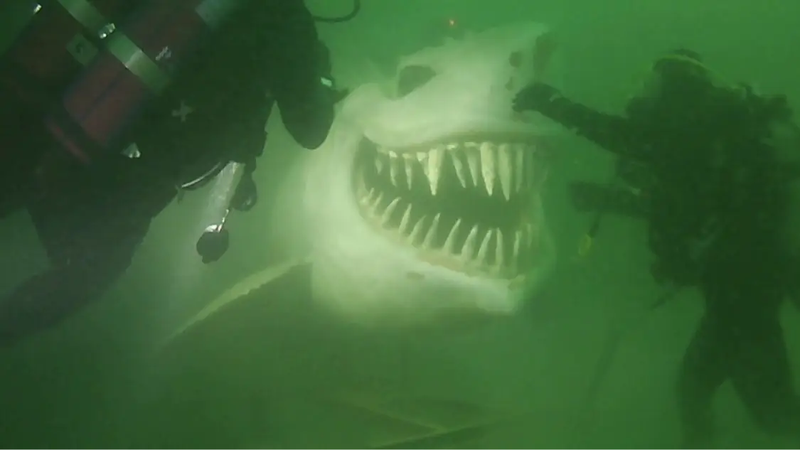 Shark statue gives divers scare of their lives after lake exploration
