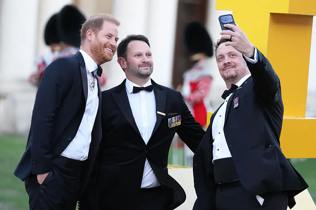 Harry enjoyed taking selfies while at the event (Getty)