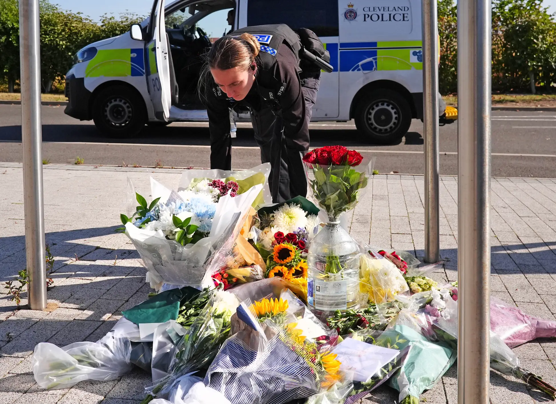 Tributes have been left at the scene (Owen Humphreys/PA Wire)
