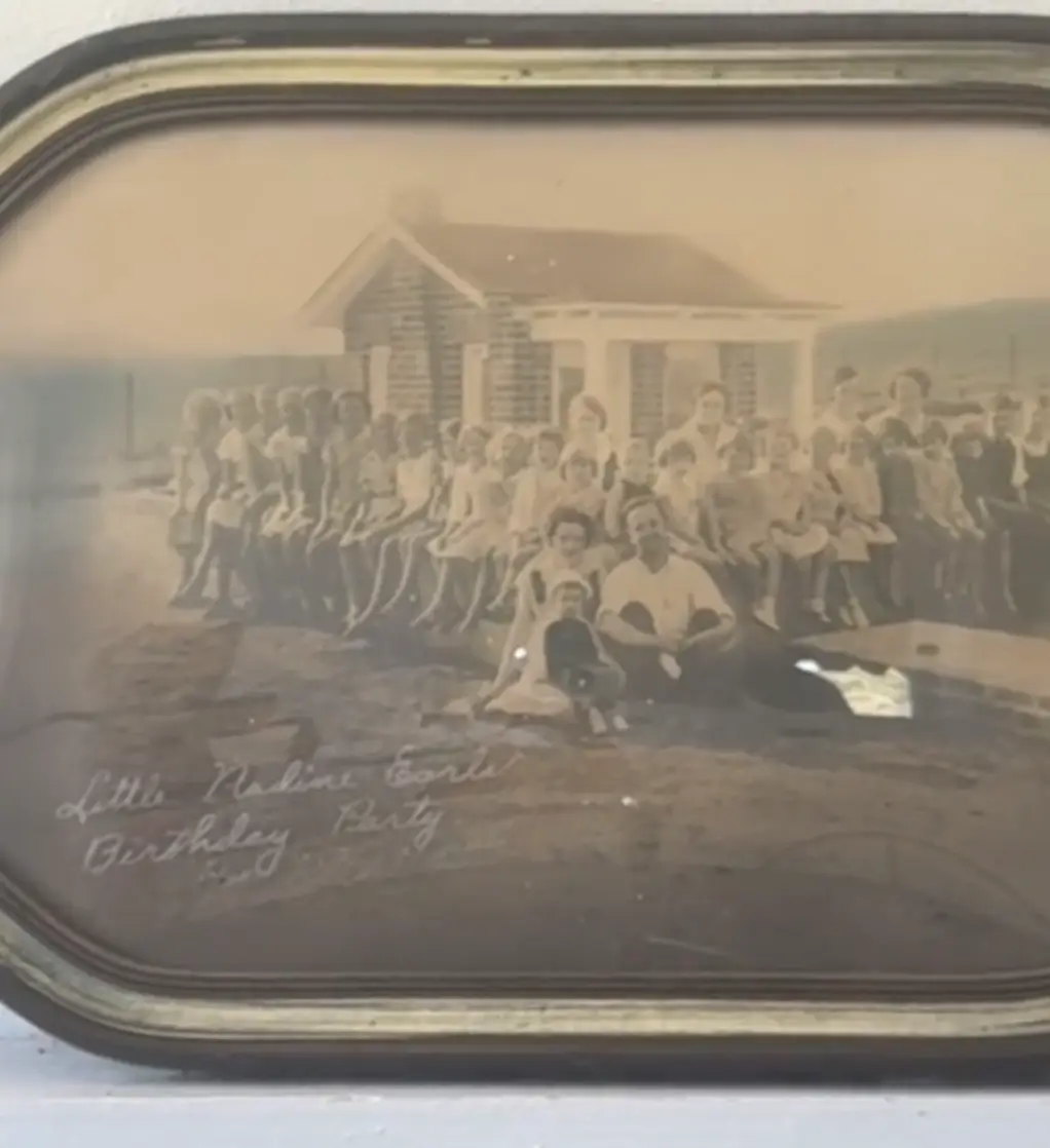 The Earles family outside the completed giant doll house (TikTok/@adventuresintohx)