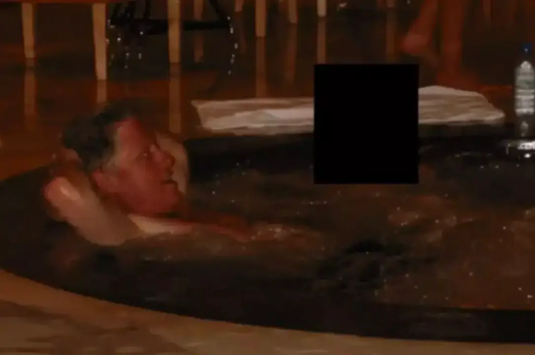 One snap appeared to show the former president lounging in a hot tub (US Department of Justice)