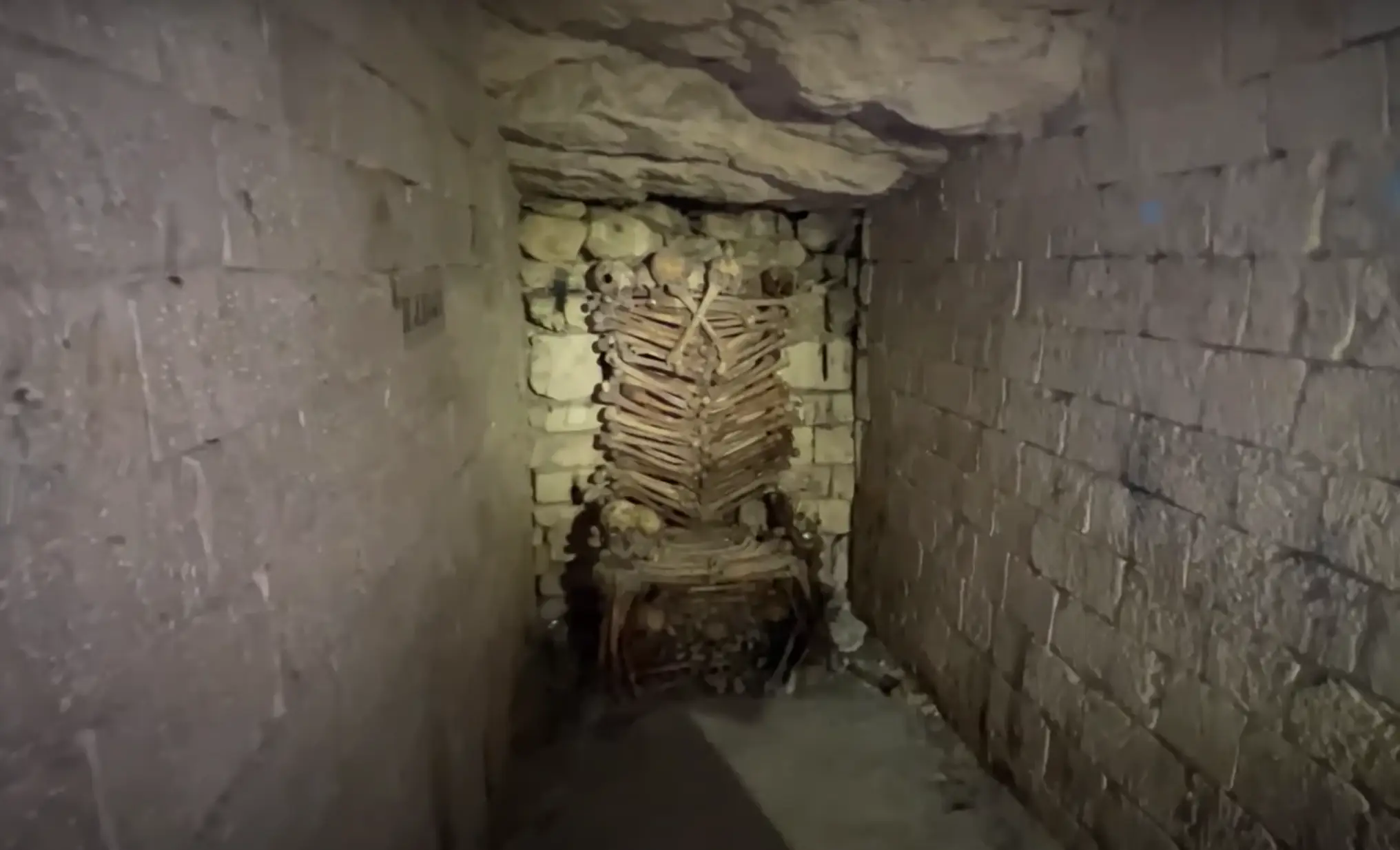 During his four hours underground, he found a throne made out of human bones (YouTube/Jorden Tually)