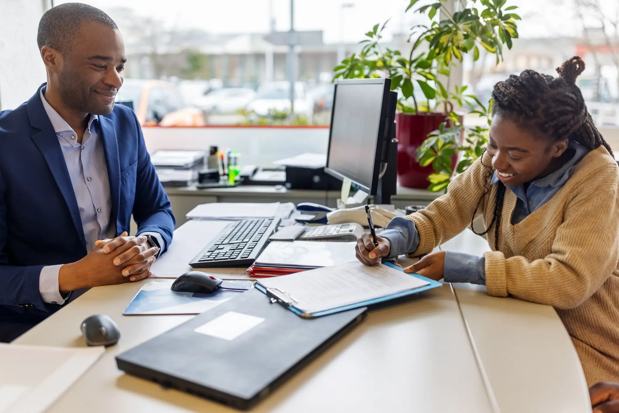 "That's right, sign that legally binding document while I try not to cackle." (Getty Stock Image)