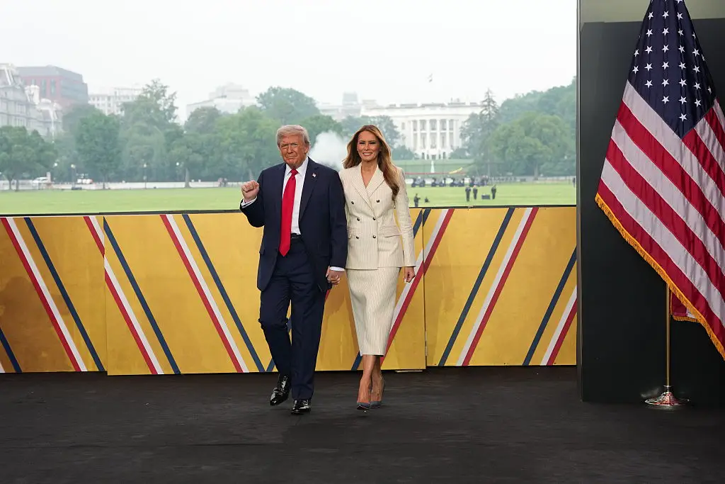 The First Lady was all smiles when she first appeared at Saturday's military event (Doug Mills - Pool/Getty Images)