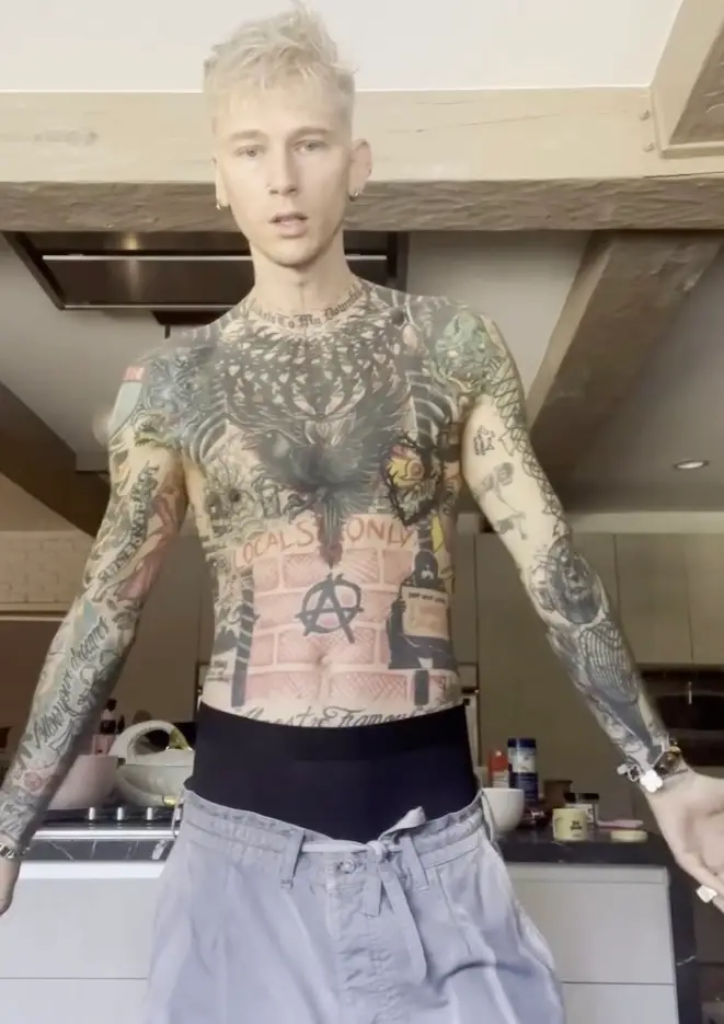 The rapper's body was previously adorned in various designs which he now considers 'chaotic'  (Instagram/@machinegunkelly)