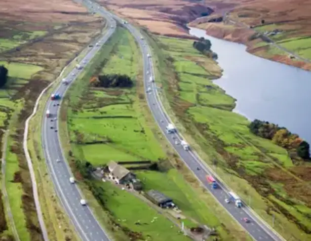 The motorway passes by on both sides.