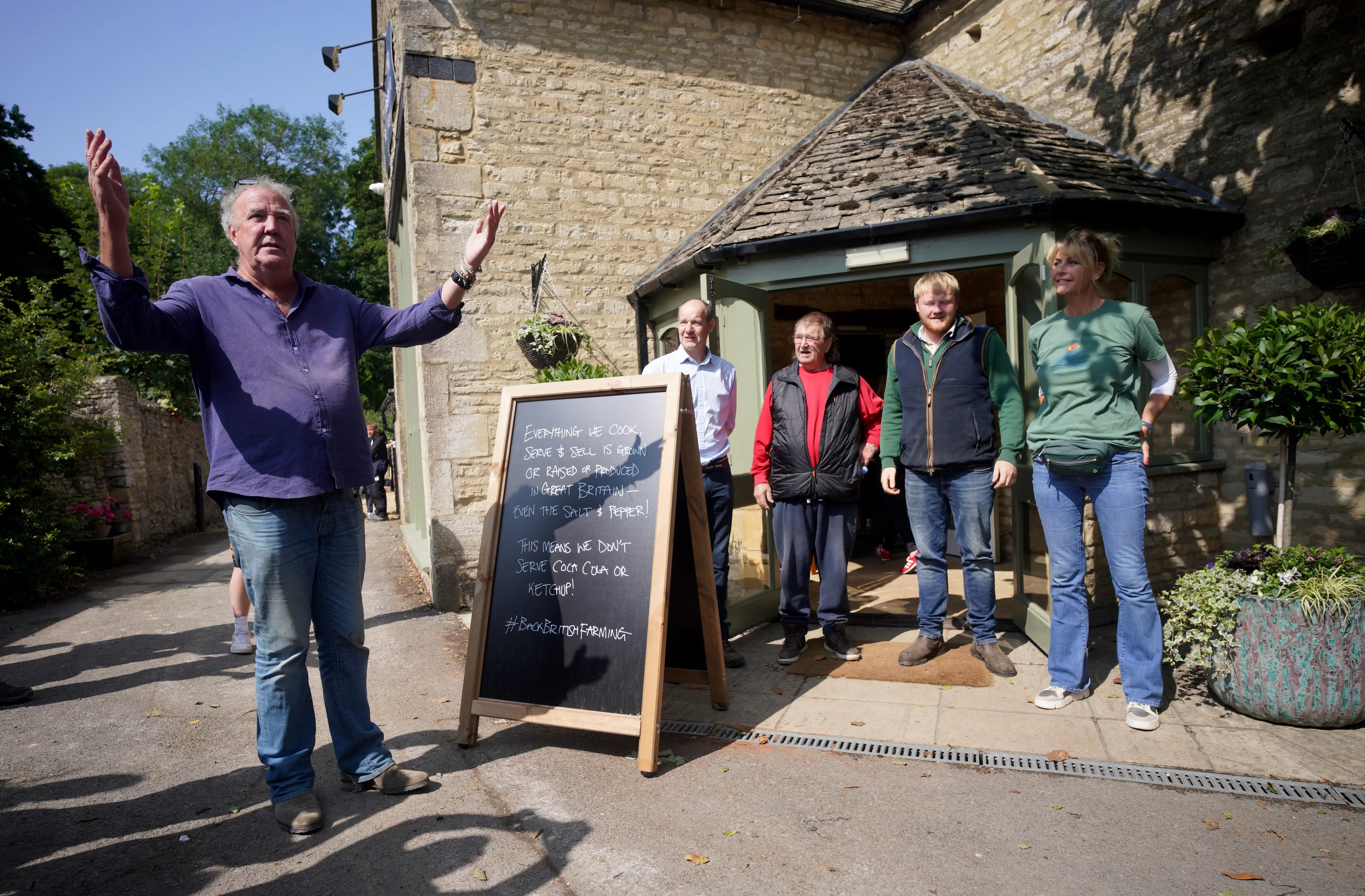 Jeremy with the Clarkson's Farm team at the pub opening (Ben Birchall/PA Wire)