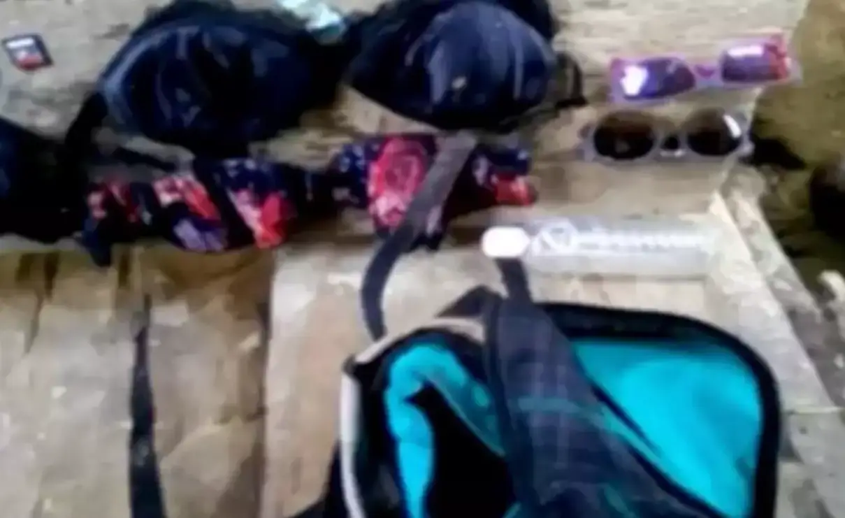 Photos found included ones of their belongings laid out on a rock. (TVN2)