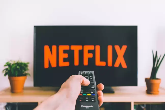 Netflix's president of advertising says millions are opting for their cheaper price-plan, which can save users up to £13 a month.