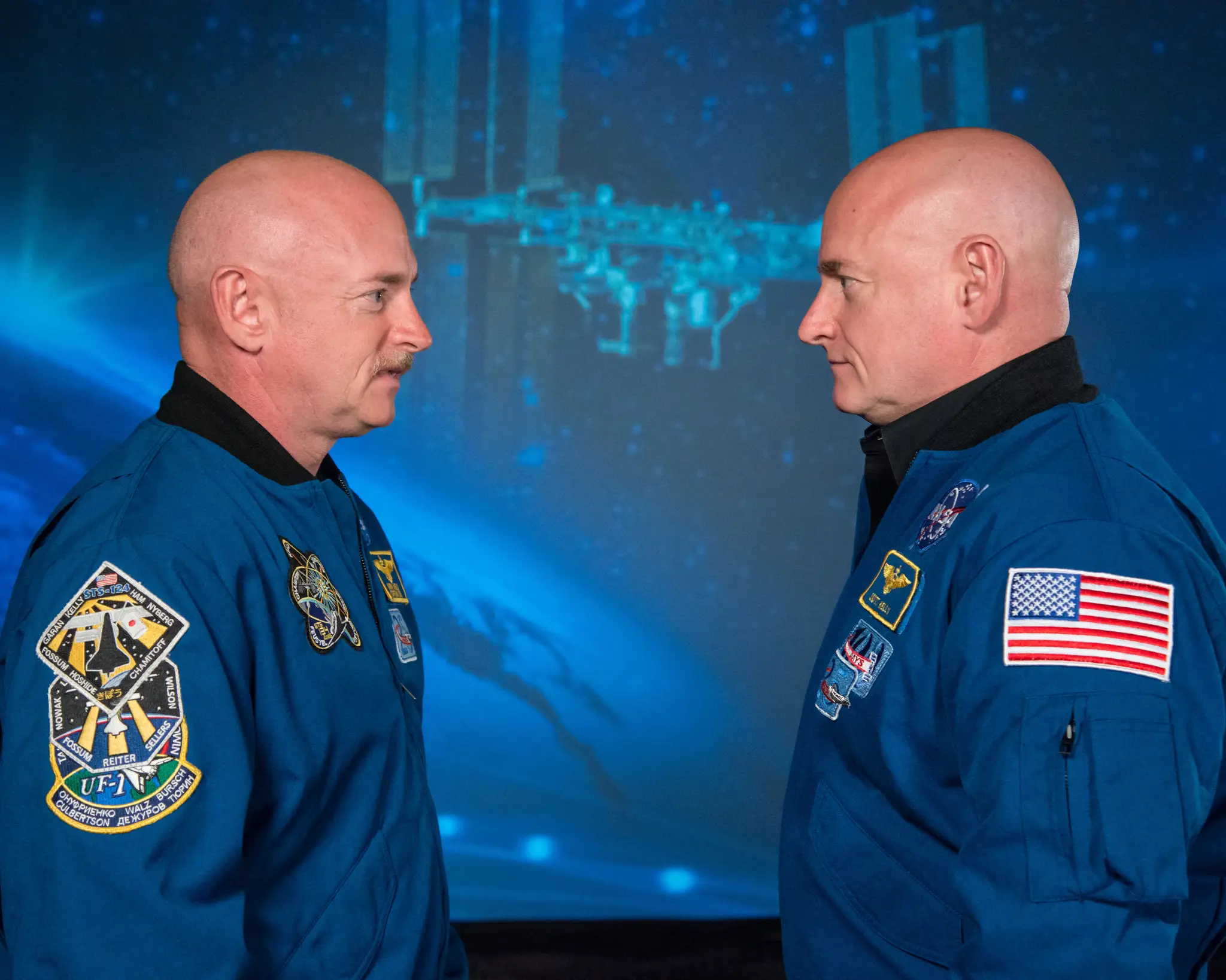 Mark Kelly (left) stayed on Earth while his twin brother Scott (right) spent a year in space (ROBERT MARKOWITZ/NASA/AFP via Getty Images)