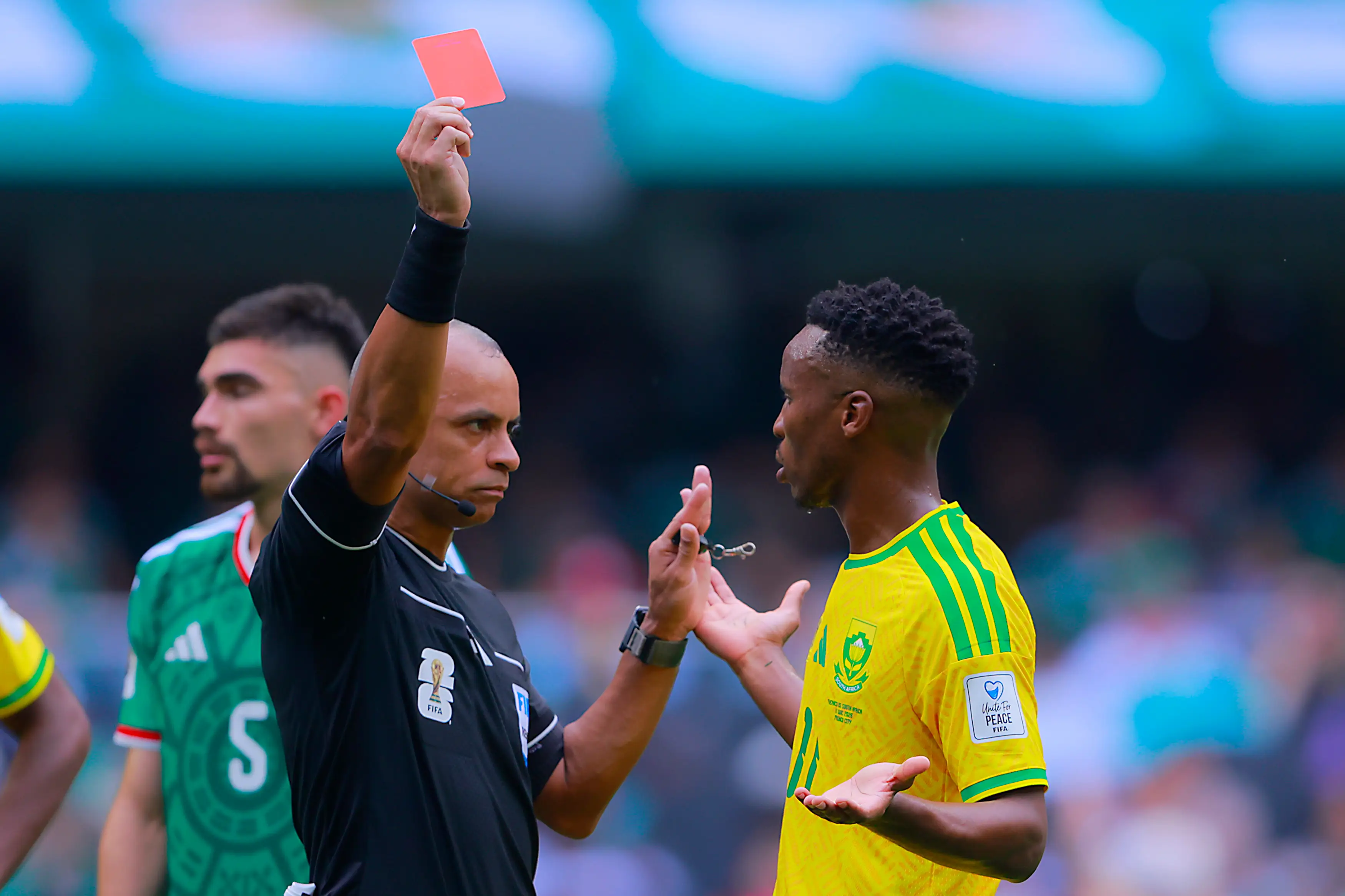 Referee Wilton Sampaio sends off Themba Zwane of South Africa. (Hugo Rivera/Jam Media/Getty Images)