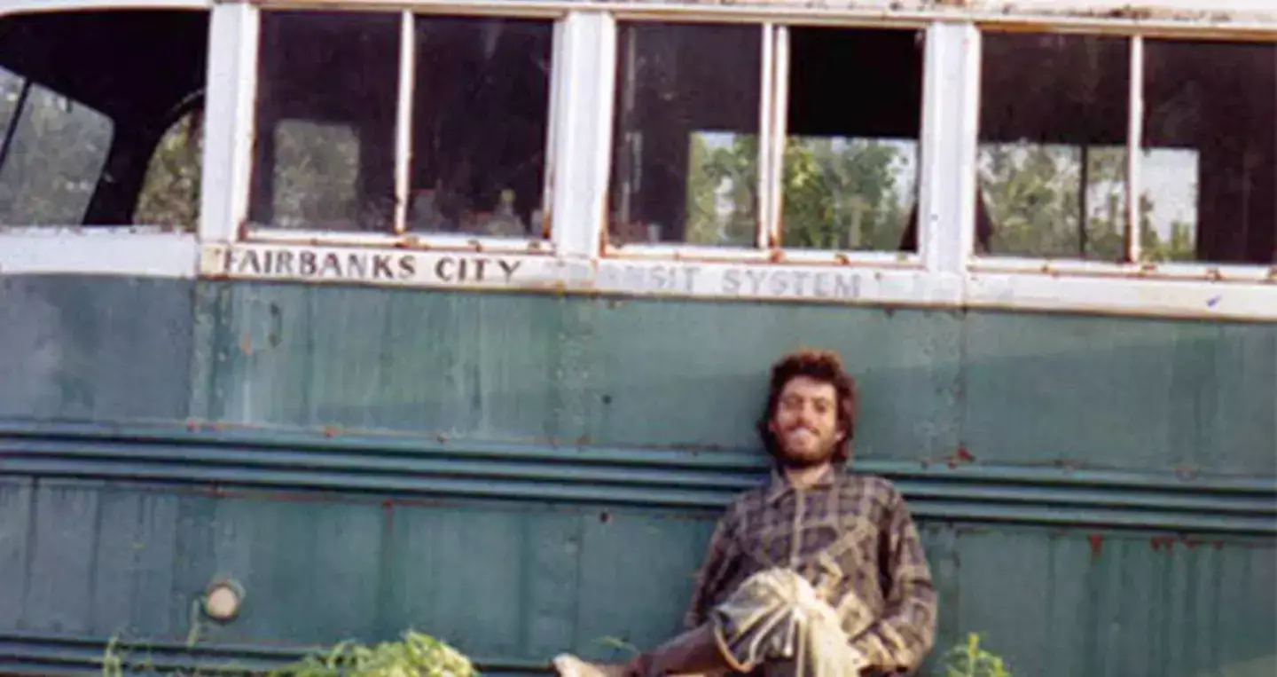 A photo McCandless had taken of himself outside his makeshift home in the bus. (Wikimedia Commons)