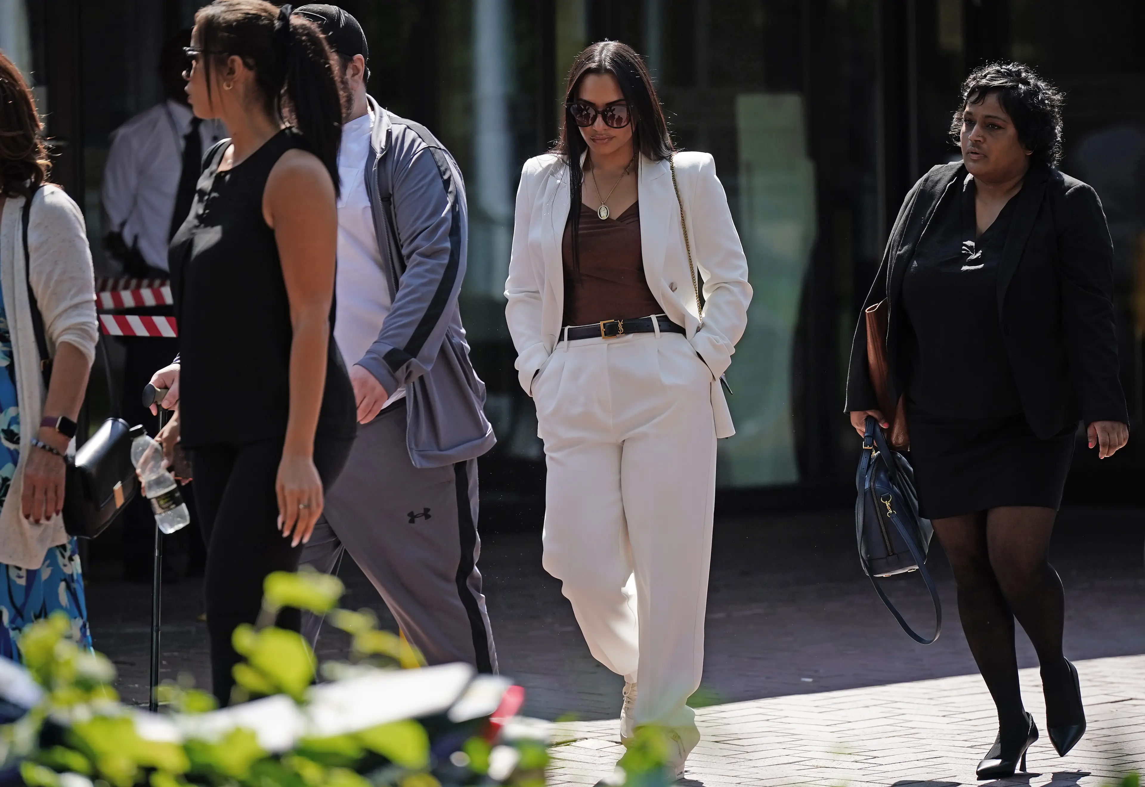 Abreu (second from right), appeared in court on Monday, where she was charged with misconduct in public office. (PA)