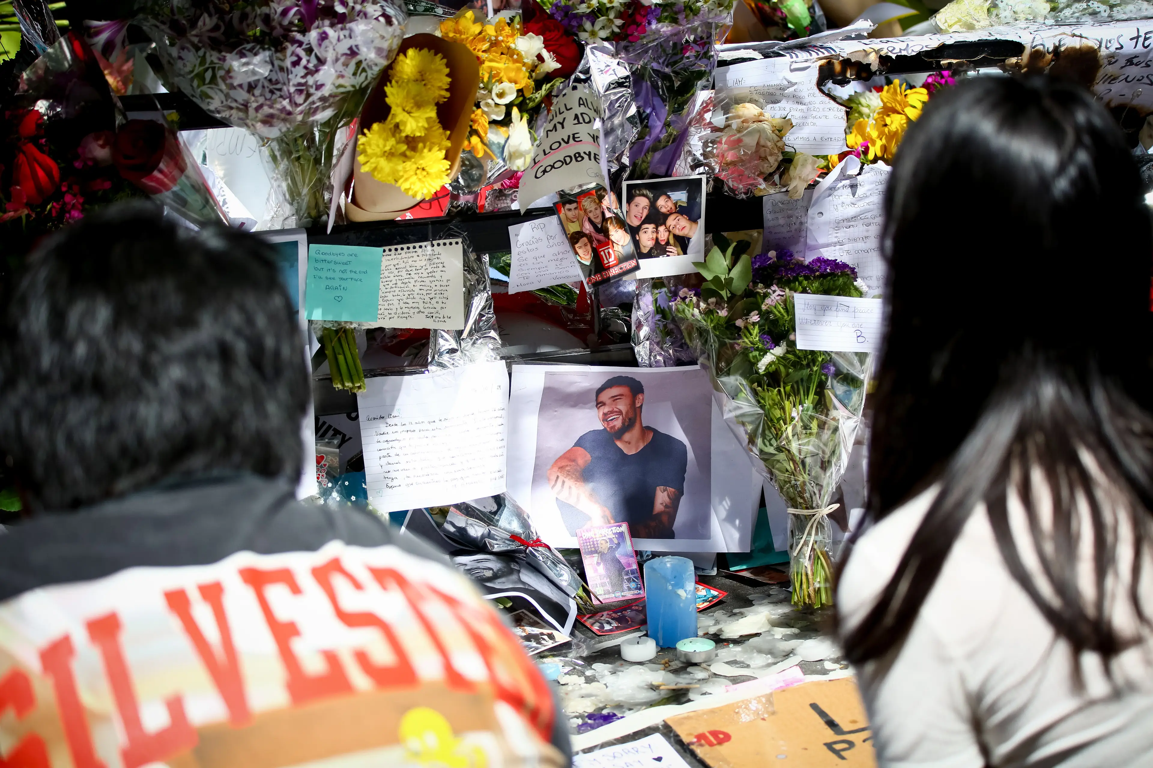 Fans paid tribute to the One Direction singer outside his hotel following reports of his death (SOPA Images via Getty Images)