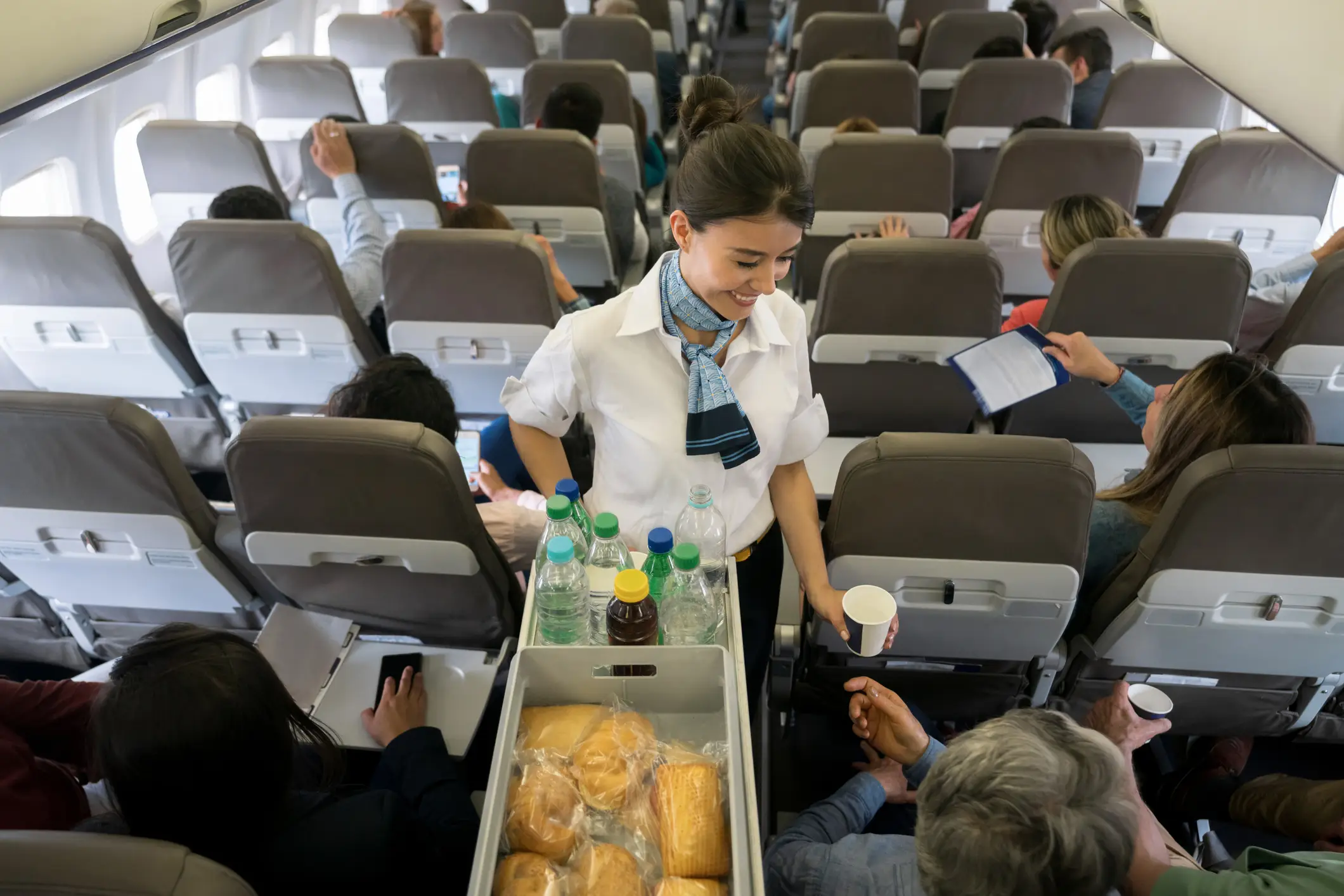 Airline staff are trained to put on a smile throughout the journey. (Getty Stock Images)