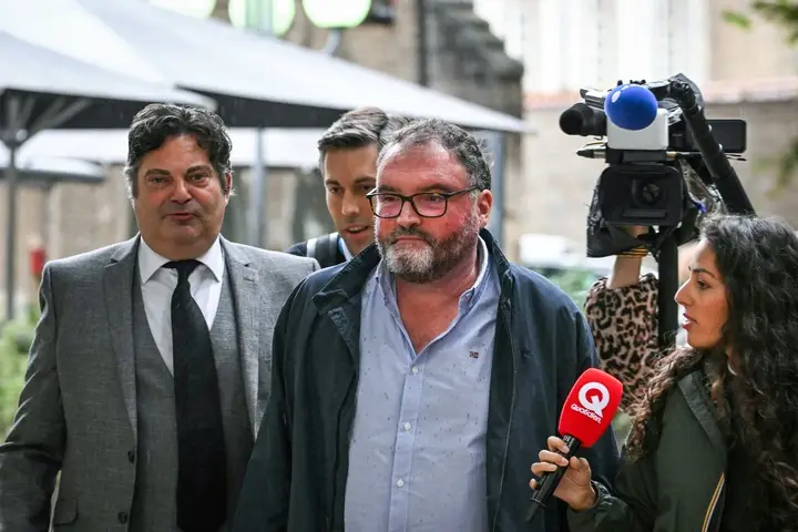 This court sketch made on September 8, 2025, shows defendant French former anaesthetist Frederic Pechier (C) near his lawyers (L) in the courtroom on the opening day of his trial, at Besancon's courthouse, in Besancon, north eastern France. Frederic Pechier, 53, goes on trial on September 8, 2025, accused of intentionally poisoning 30 patients, 12 of whom died, in an alleged attempt to show off his resuscitation skills and discredit co-workers (BENOIT PEYRUCQ/AFP via Getty Images)