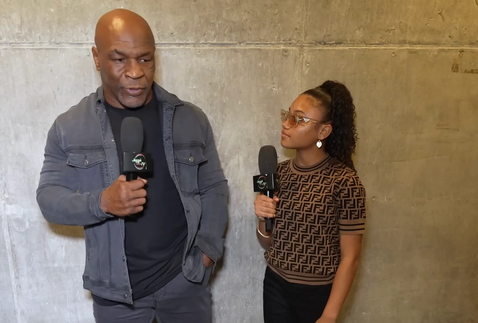 The teen handled the awkward moment with Mike Tyson pretty well (Jazzys World TV/YouTube)