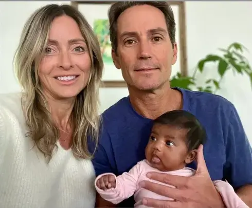 Scott and Mills, pictured with Shea, will retain custody of the little girl (GoFundMe)