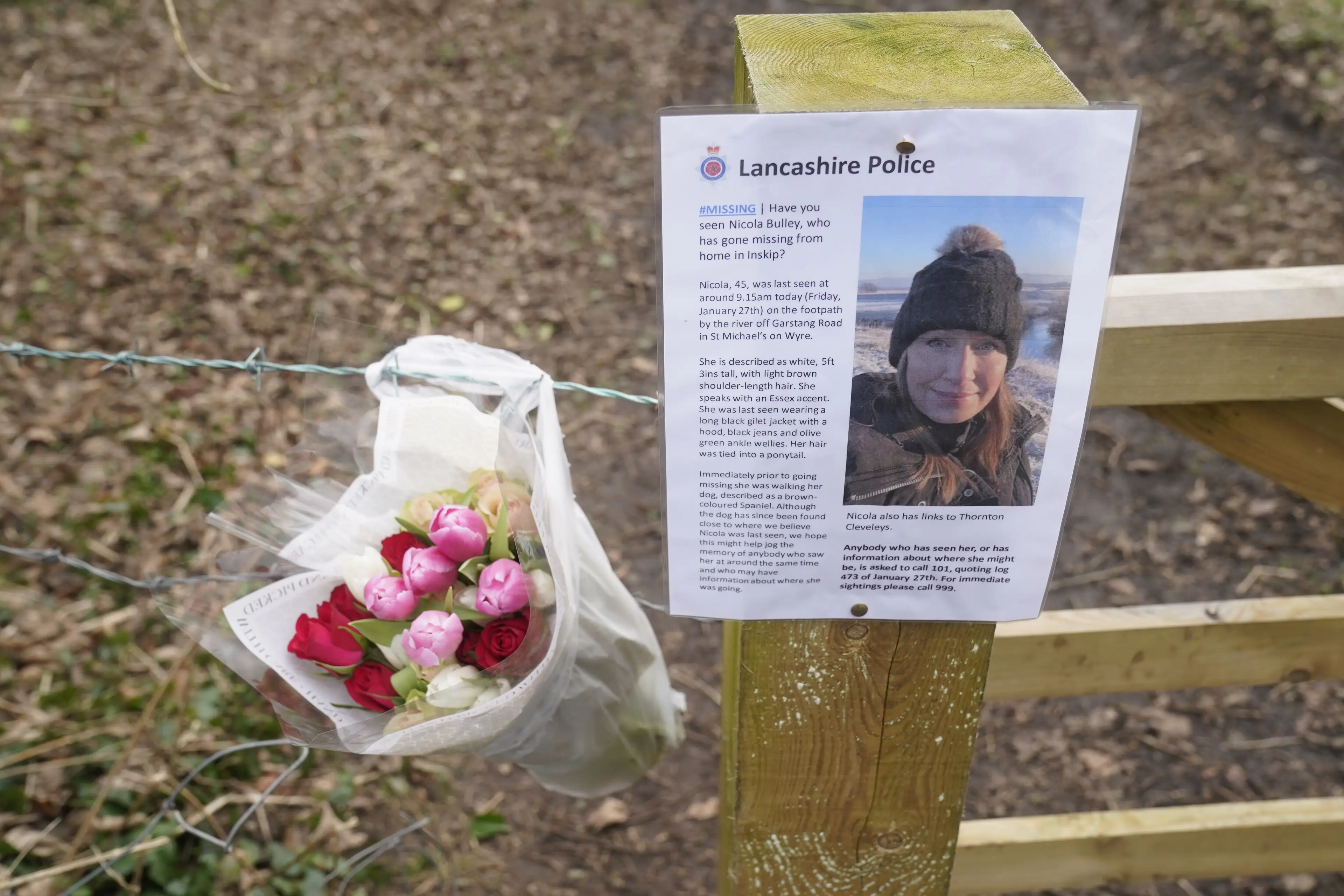 Flowers left at one sign appealing for information on where Nicola could have been (Danny Lawson / PA Wire)