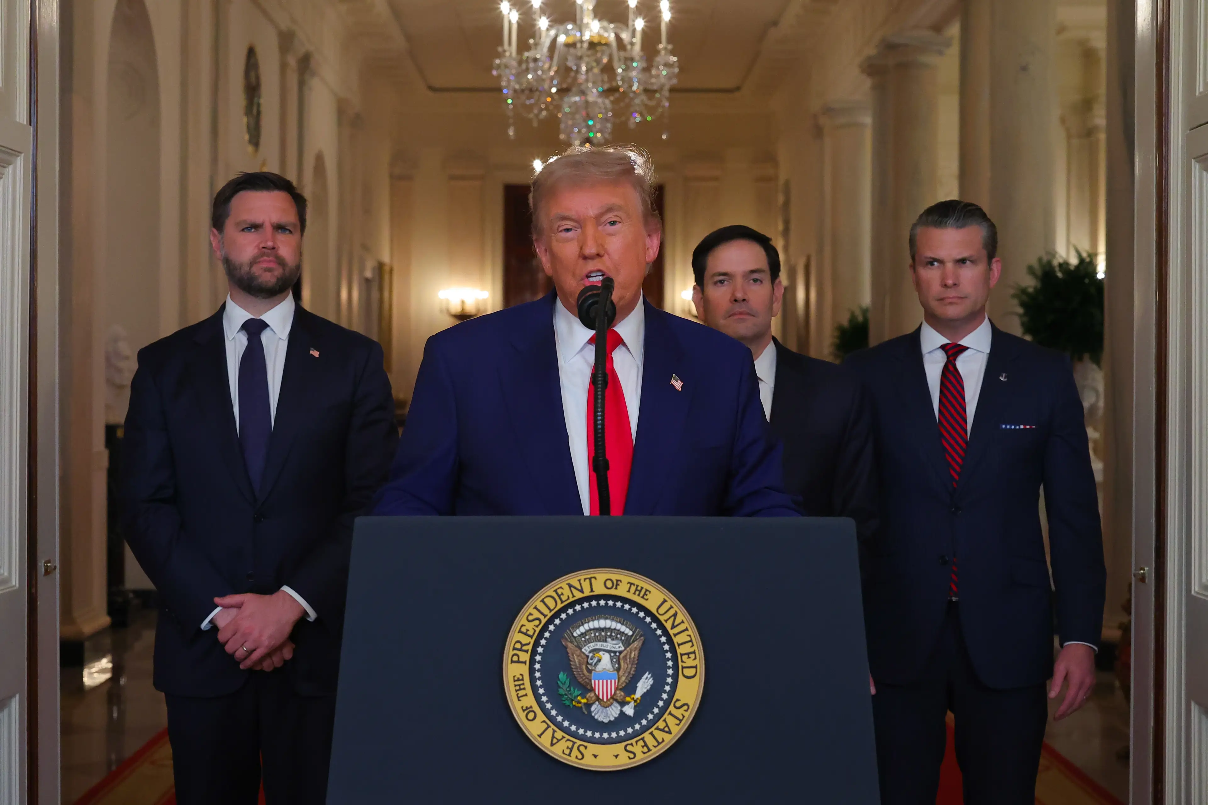 Trump seen addressing the nation in wake of the strikes alongside JD Vance (left) Marco Rubio and Pete Hegseth (Carlos Barria - Pool/Getty Images)