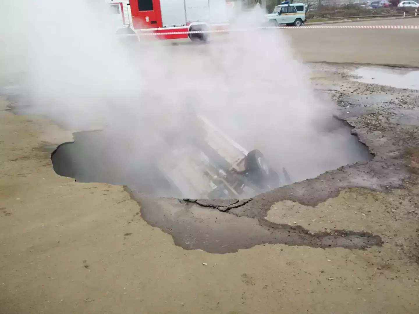 The car ended up in the sink hole. (East2West News)