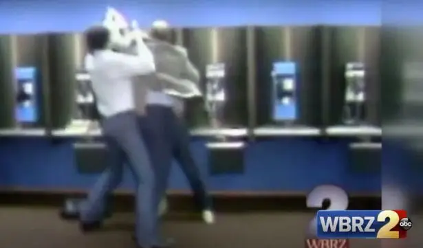 Police grab hold of Gary Plauché after he shot Jeffrey Doucet.