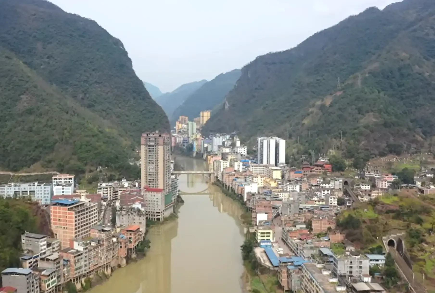 The buildings right by the river are on stilts to protect from the regular flooding (YouTube/Little Chinese Everywhere)