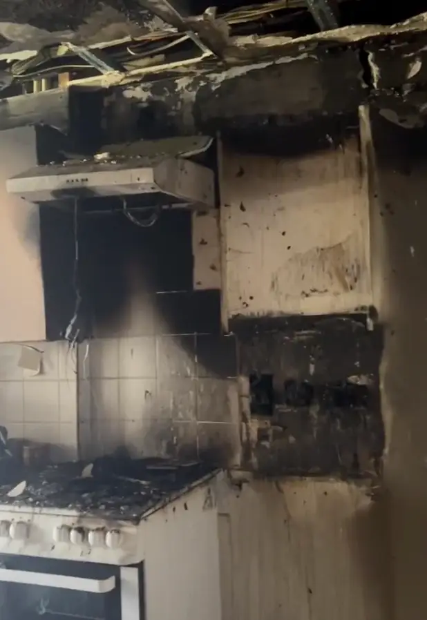 The kitchen was left black and burned by the fire.